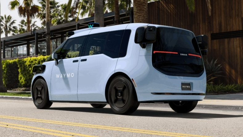 White Waymo autonomous vehicle operating on public roadway